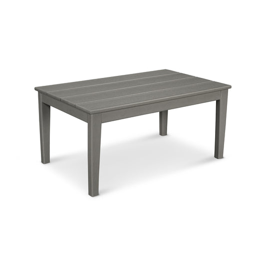 A rectangular gray POLYWOOD Newport 22"x36" Coffee Table made of molded POLYWOOD®, featuring a slatted top design, on a plain white background.