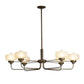 A Hubbardton Forge Nola Pendant chandelier featuring six frosted glass shades.