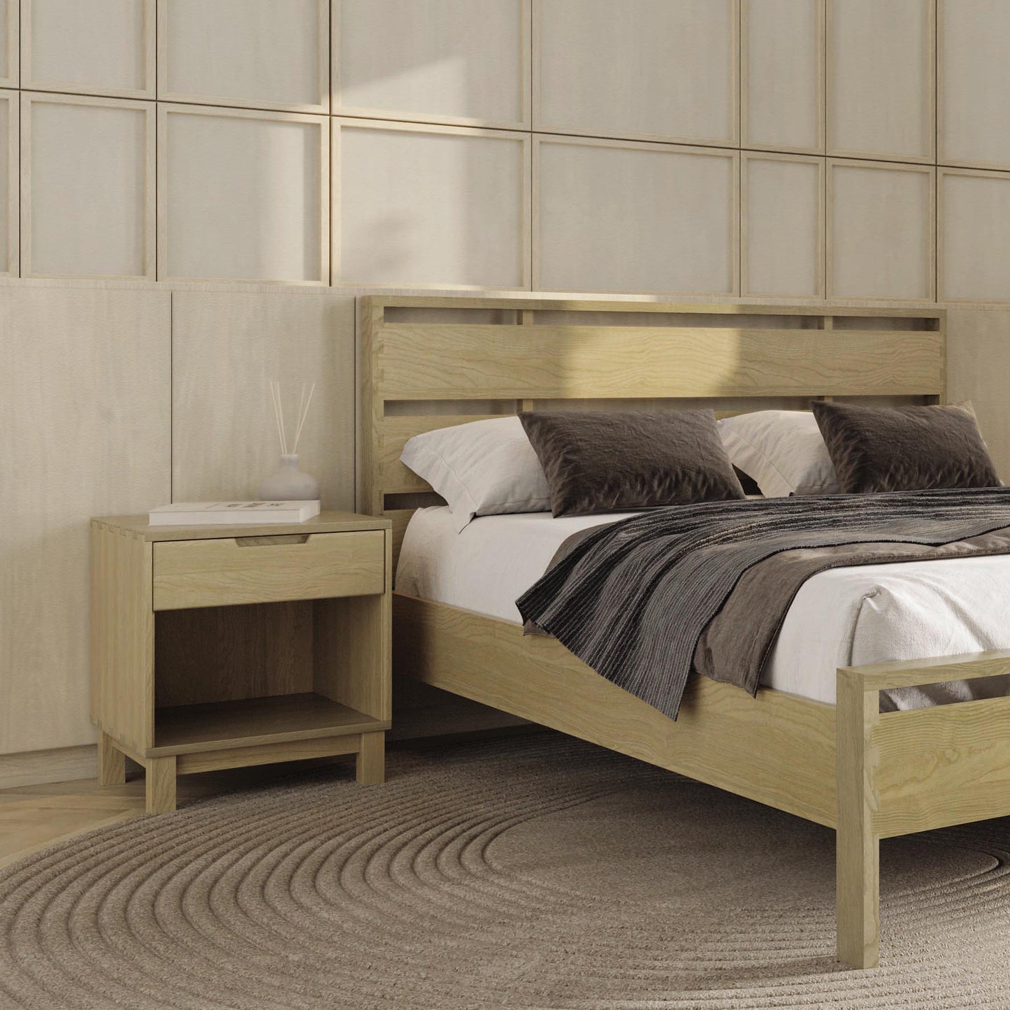 Wooden bed with gray bedding and Copeland's Oslo Nightstand on solid oak flooring.
