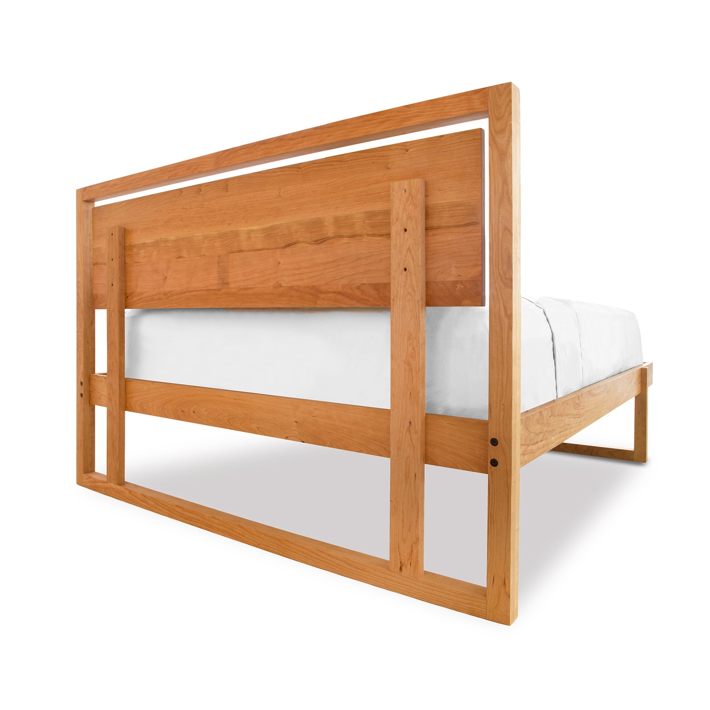 Minimalist wooden bed frame with rectangular headboard made from eco-friendly cherry wood by Vermont Furniture Designs.