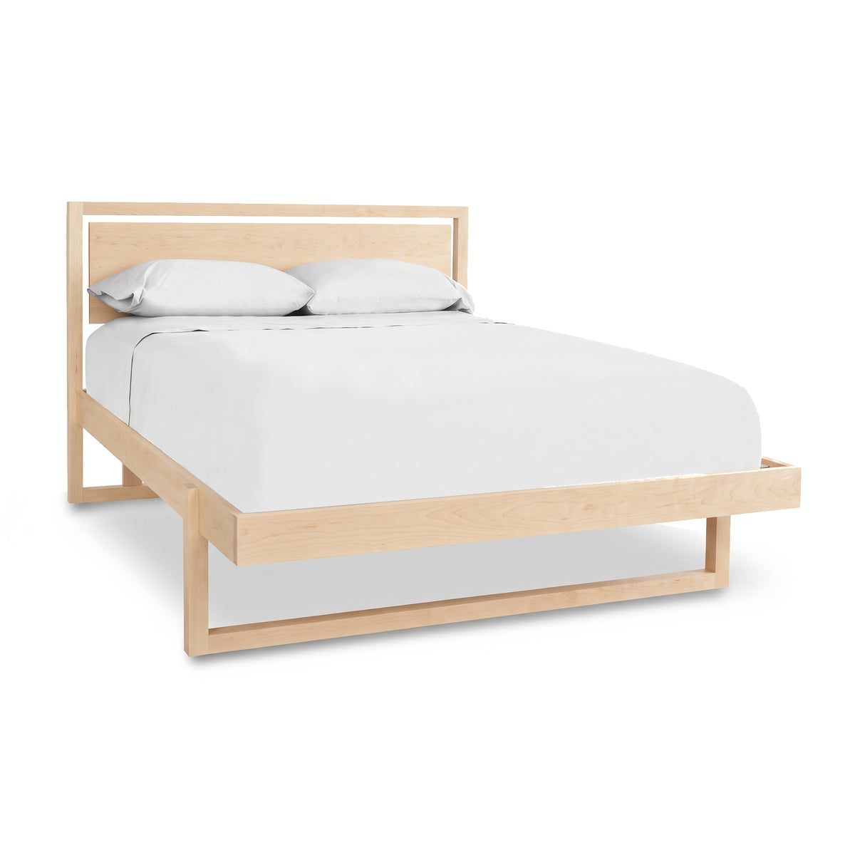 Minimalist wooden bed frame, The Pendant Bed by Vermont Furniture Designs, crafted from sustainably harvested cherry wood.