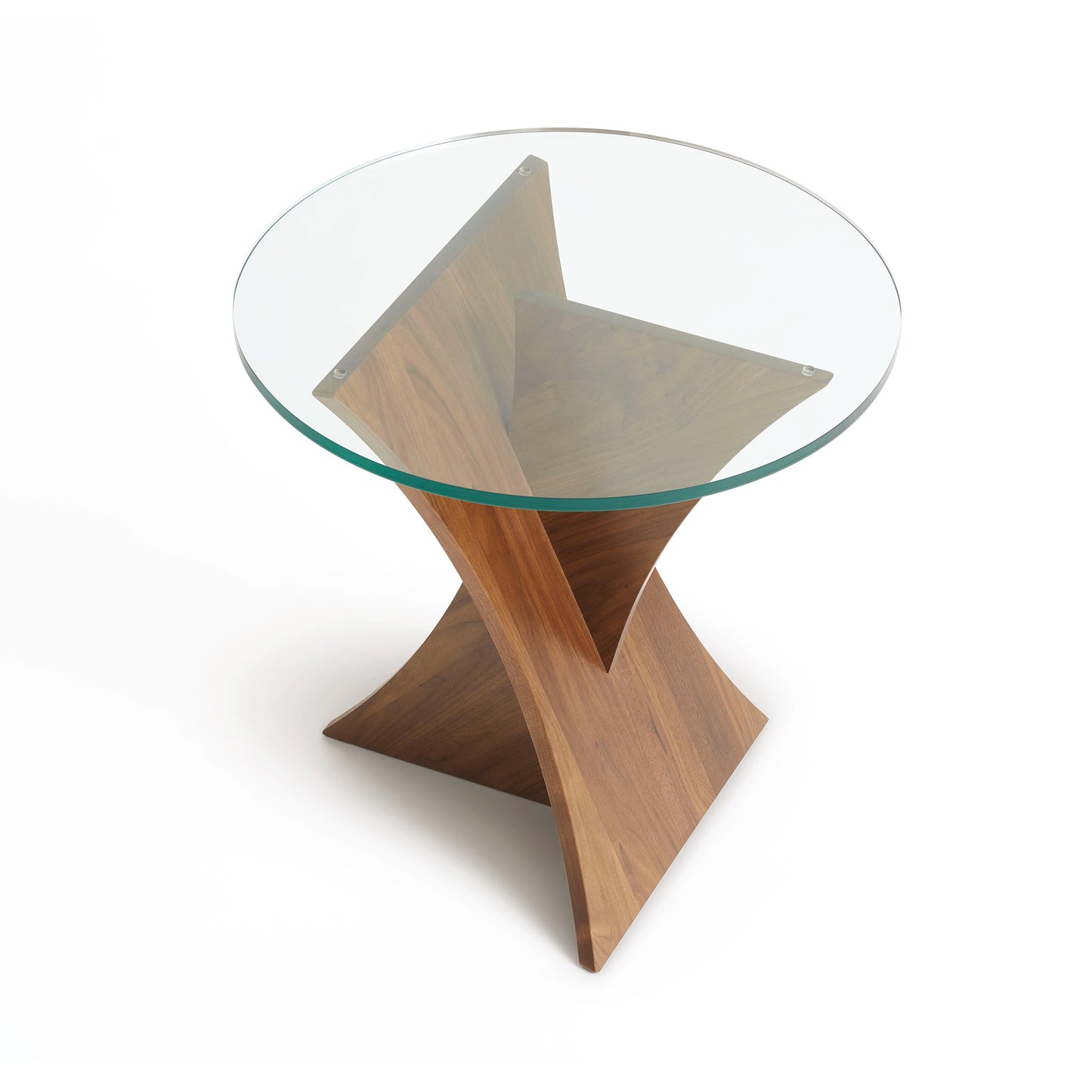 Planes Round Glass Top End Table by Copeland Furniture with a circular tempered glass surface and uniquely crafted walnut base, highlighting modern artisanal design.