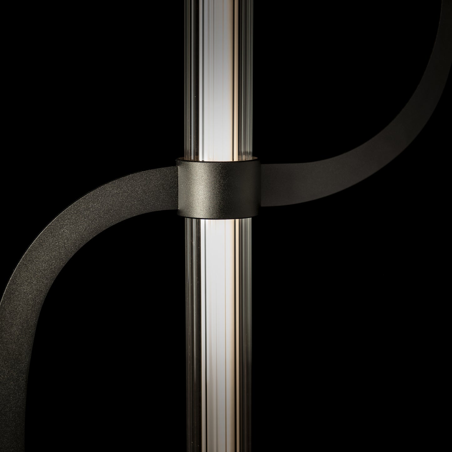 Hubbardton Forge Pulse Floor Lamp with a cylindrical LED tube and sleek black metal arms.