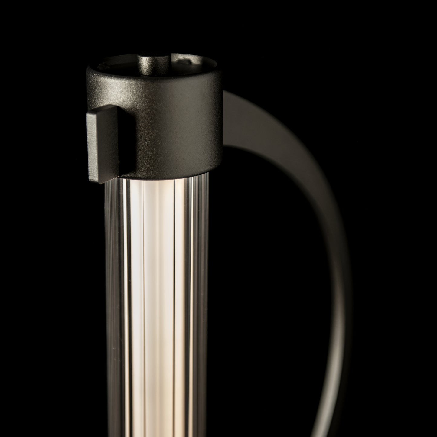 Hubbardton Forge Pulse Floor Lamp with vertical translucent panel and dark metal frame.