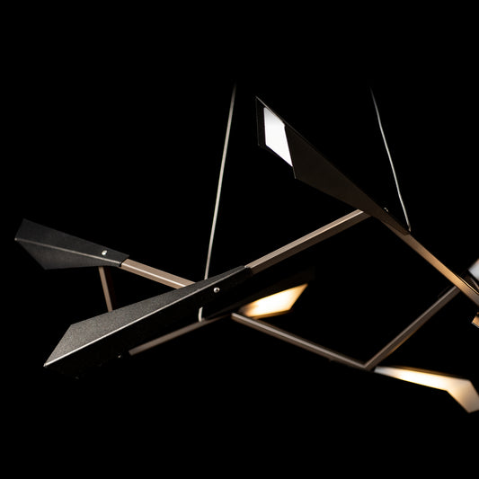 Quill Pendant light fixture with modern geometric arms and illuminated panels, showcasing elegant American craftsmanship by Hubbardton Forge.