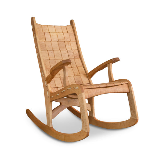 A Quilted Vermont Birdseye Maple Rocking Chair with a curved base and woven seat and backrest, displayed against a white background by Vermont Folk Rocker.