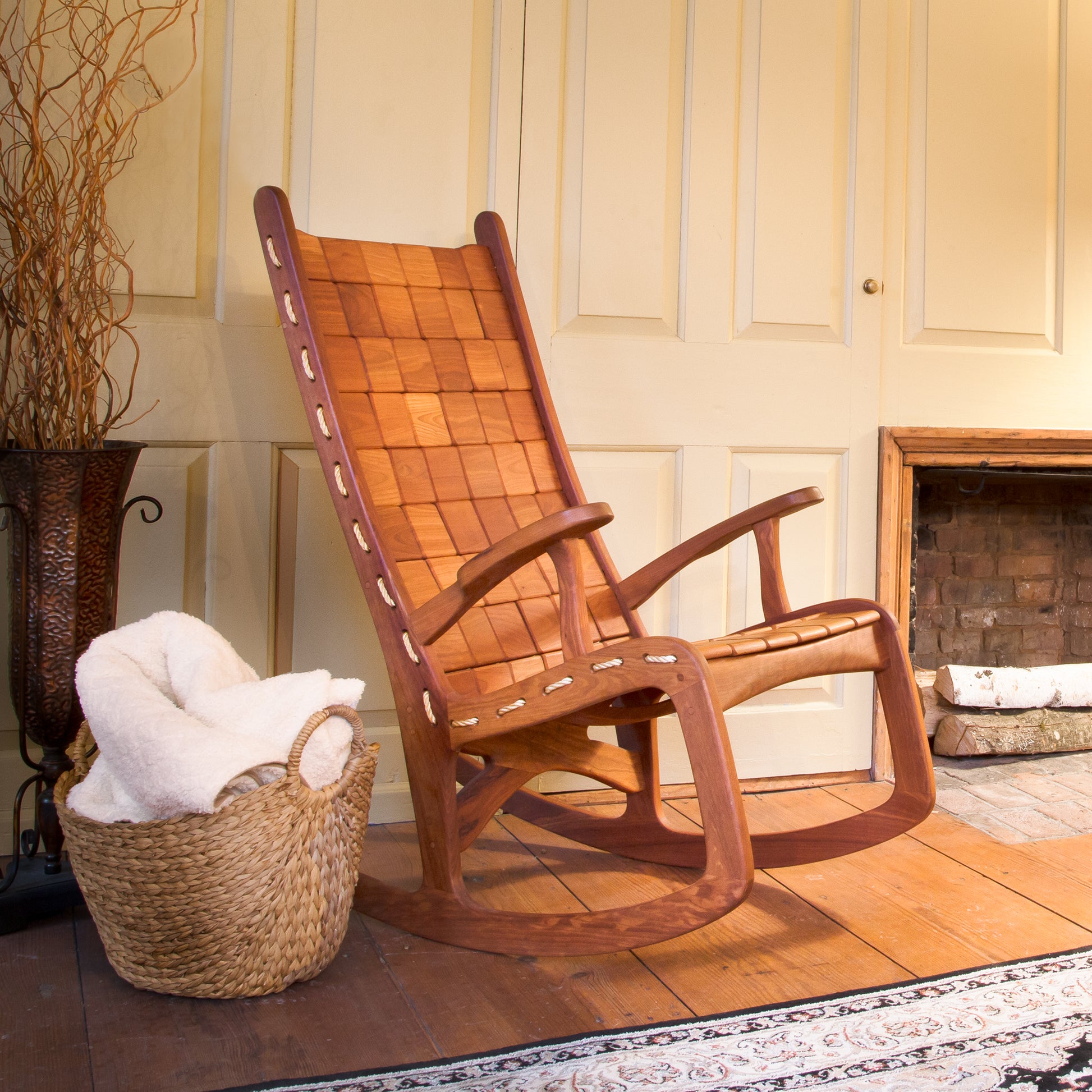 The Vermont Folk Rocker Quilted Vermont Rocking Chair, handcrafted from solid wood, showcases fine Vermont craftsmanship and timeless design.