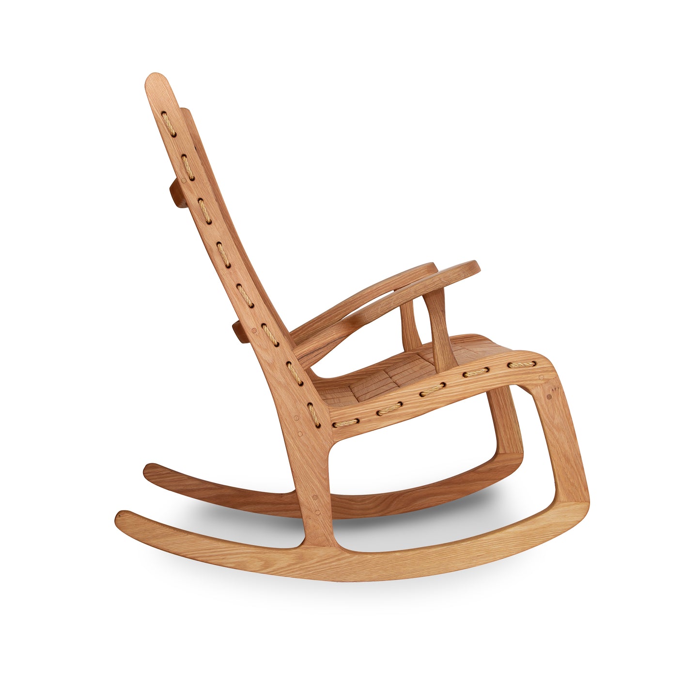 A Quilted Vermont Oak Rocking Chair by Vermont Folk Rocker, in a modern design, featuring a light oak finish with visible joinery details, positioned against a white background.