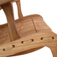 Close-up of a Quilted Vermont Oak Rocking Chair by Vermont Folk Rocker showing detailed joinery and woven seat fastenings. The texture of the light brown wood is clearly visible.