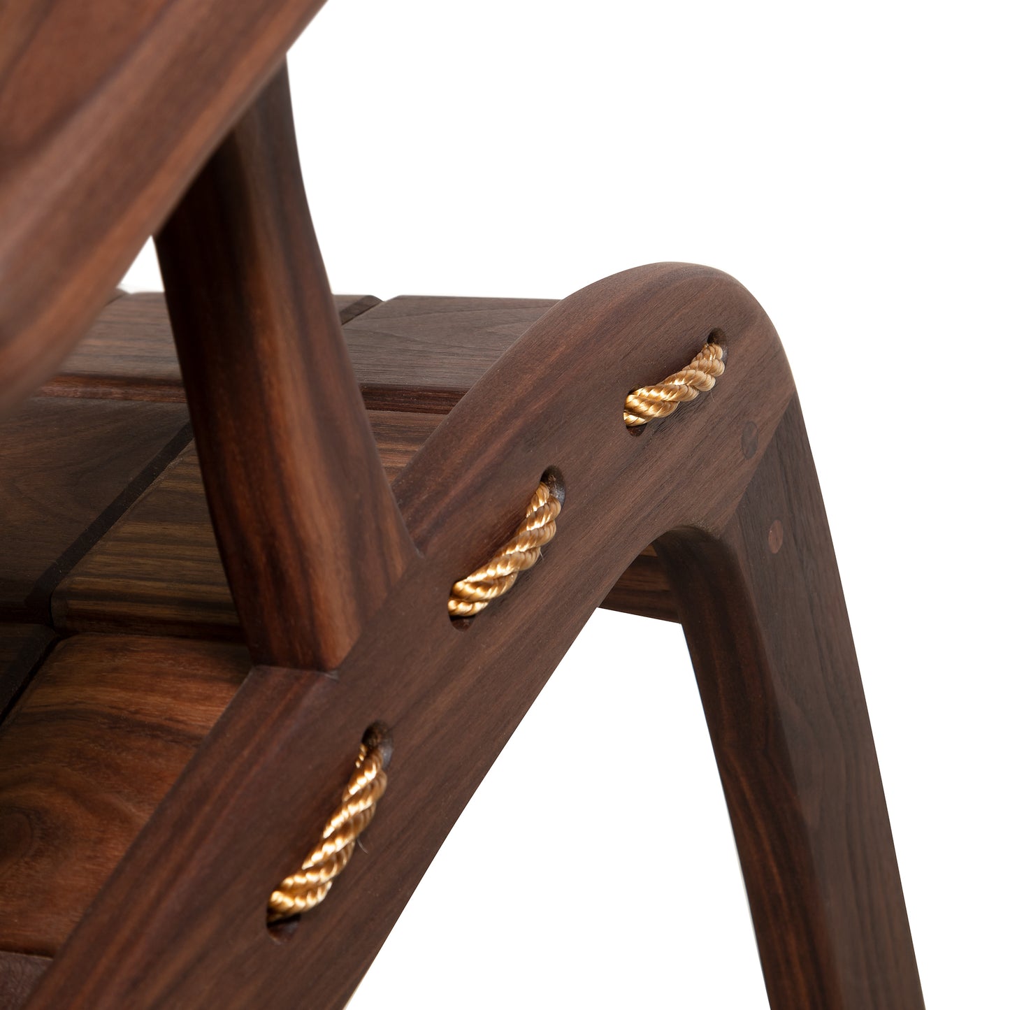 Quilted Vermont Walnut Rocking Chair by Vermont Folk Rocker featuring curved legs and decorative braided rope joints.