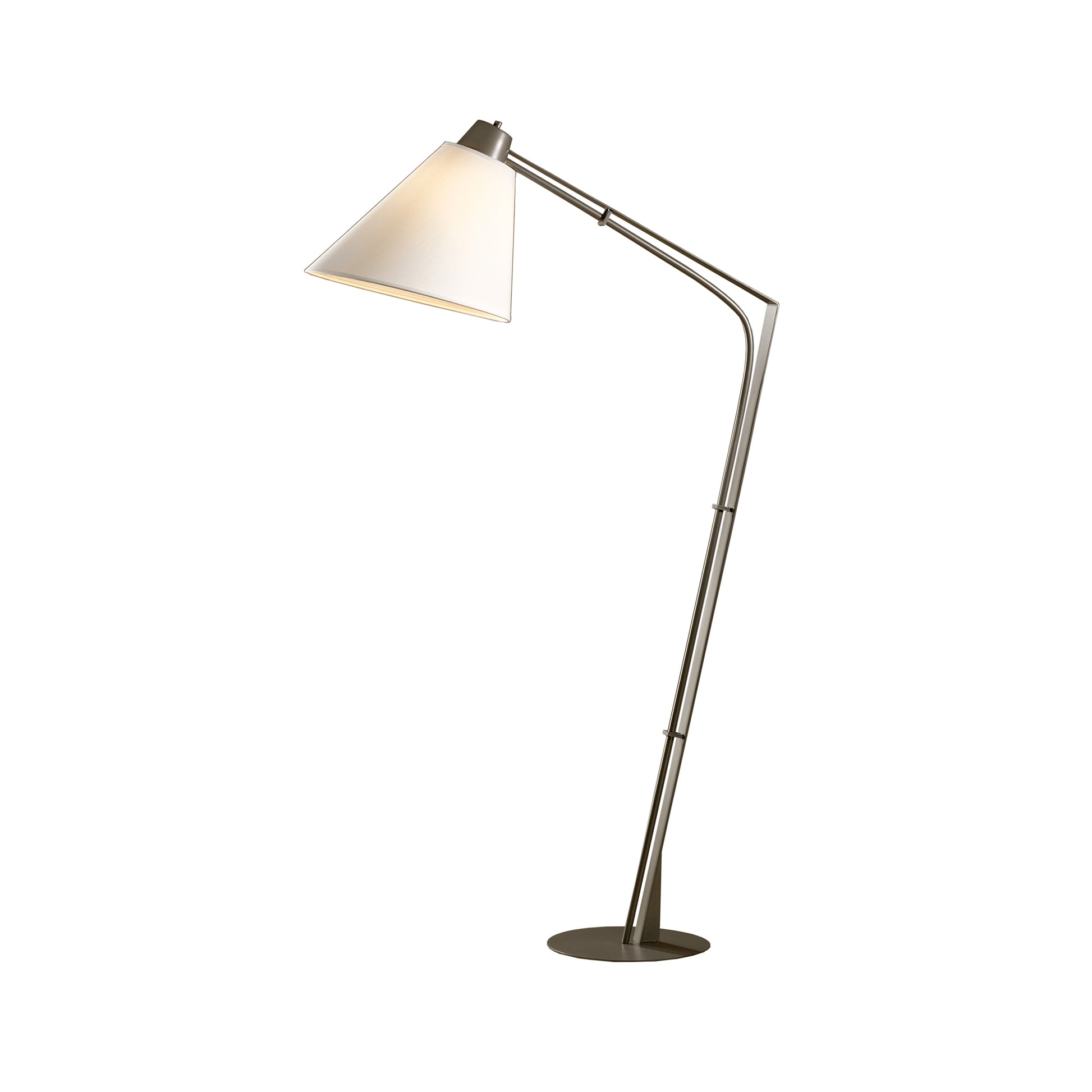 A Hubbardton Forge Reach Floor Lamp with a white shade on a white background, providing a retro chic ambiance.
