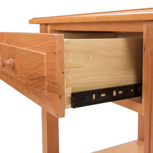 Lyndon Furniture Renfrew Shaker 1-Drawer Nightstand crafted from sustainably sourced hardwood, featuring a single drawer with smooth metal slides.