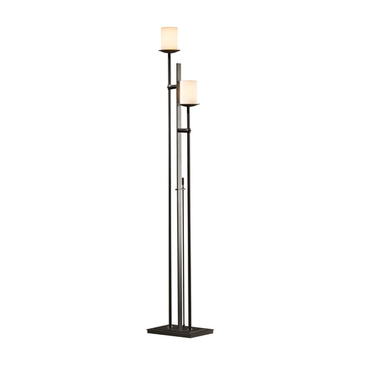 The Hubbardton Forge Rook Twin Floor Lamp features a sleek black design with a stylish white shade.