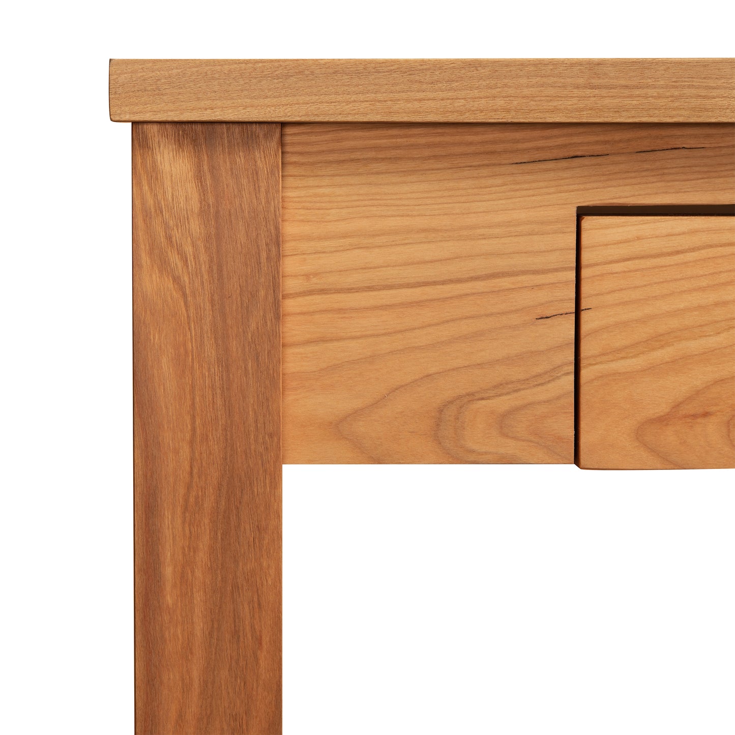 Ryegate Writing Desk corner detail, highlighting the light wood's grain and texture; handcrafted solid wood by Maple Corner Woodworks with a sharp edge and smooth surface.