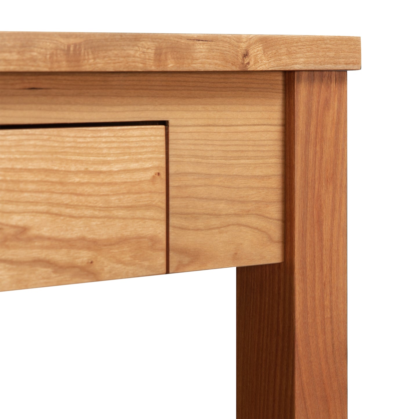 Ryegate Writing Desk corner with drawer, handcrafted by Maple Corner Woodworks in Vermont, showcasing solid wood construction with a light, natural finish that highlights the grain and texture.