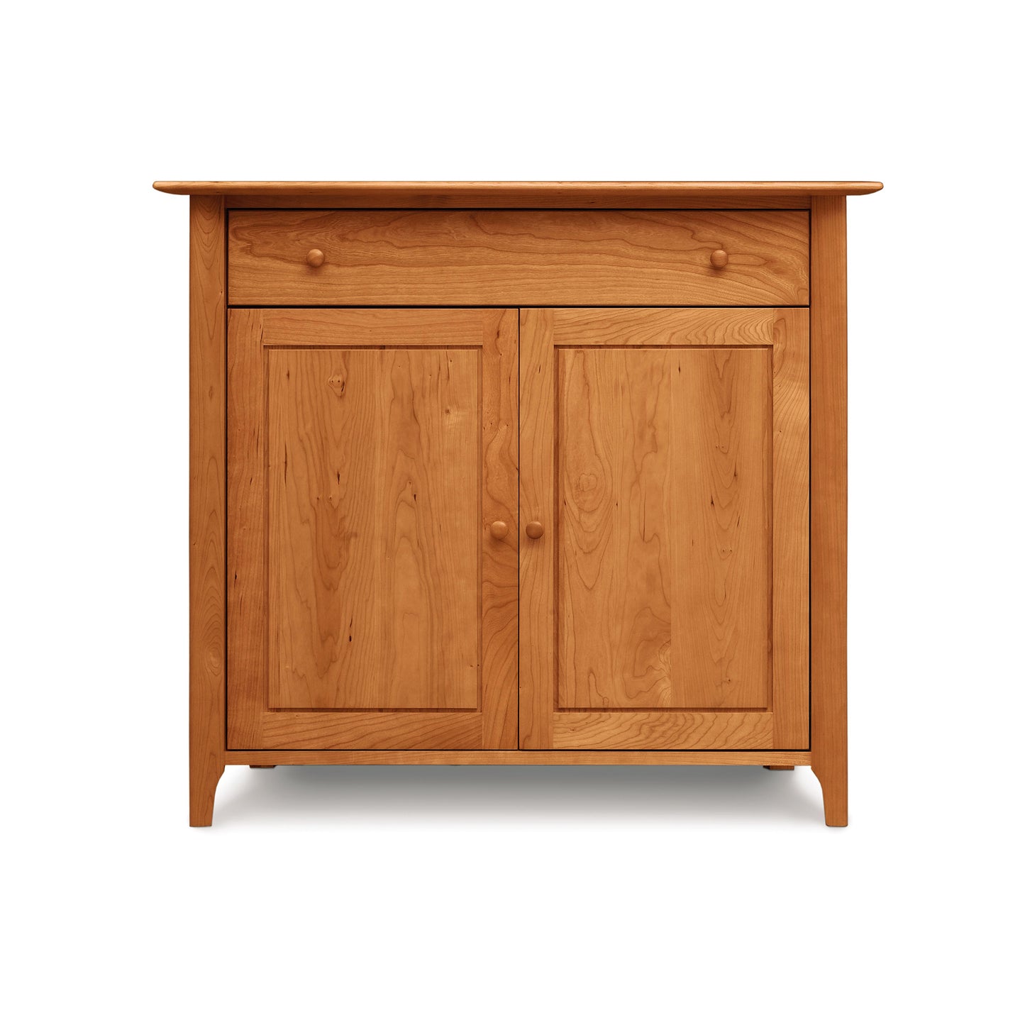 Solid wood cabinet with two doors and a single drawer, set against a white background.Copeland Furniture's Sarah 1-Drawer, 2-Door Buffet
