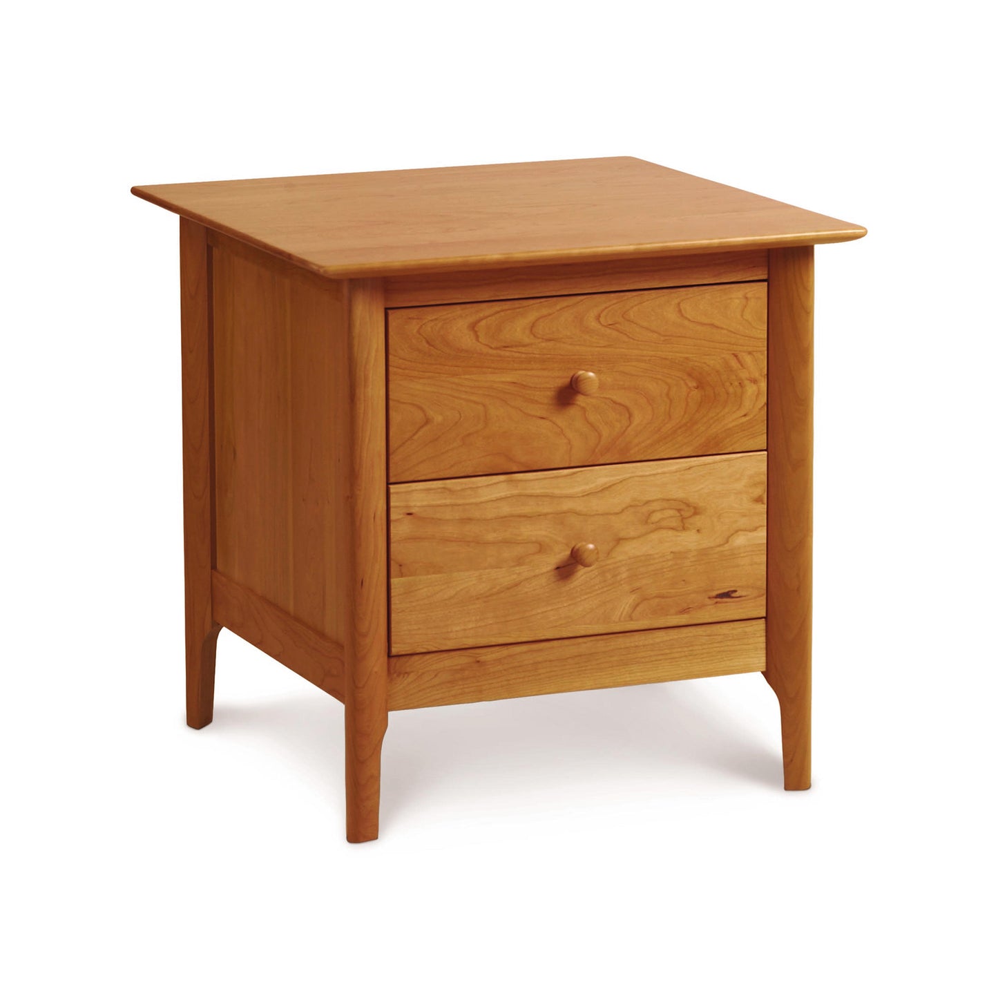 A wooden Sarah 2-Drawer Nightstand, crafted from sustainable harvested wood, isolated on a white background by Copeland Furniture.