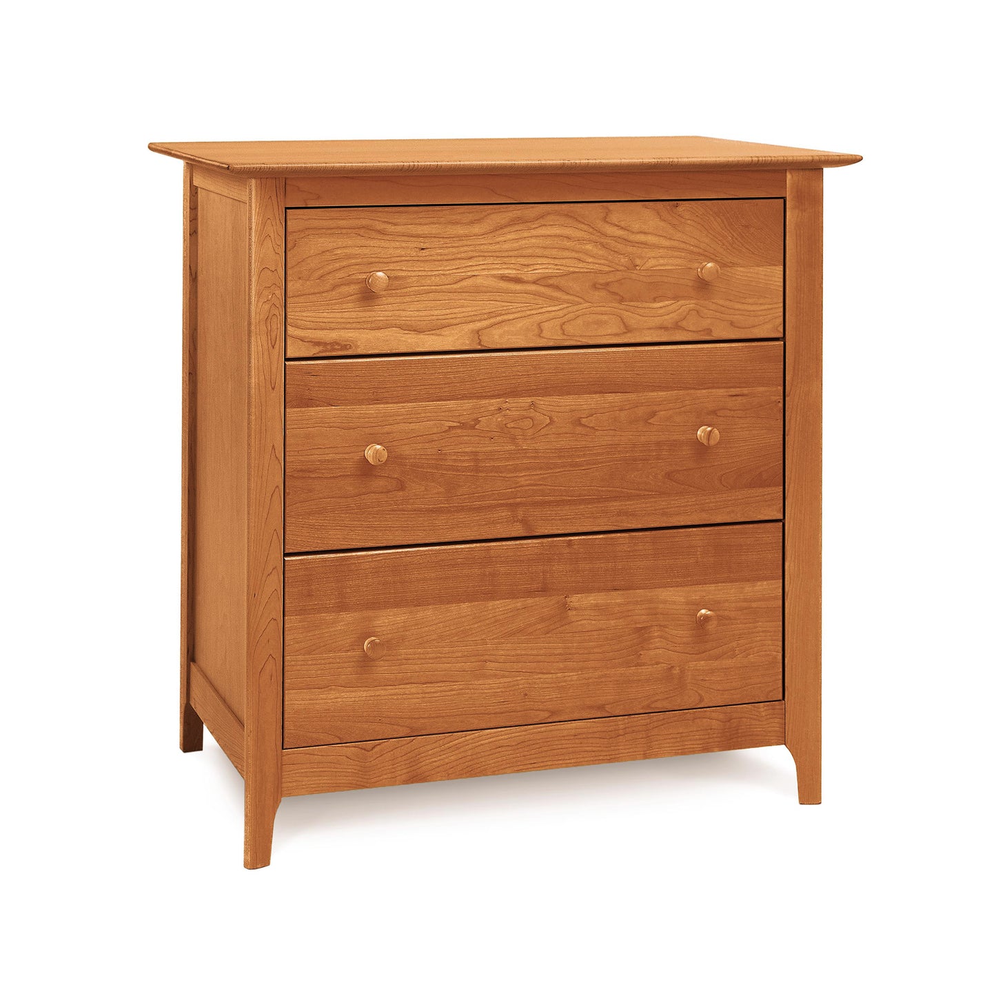 A handmade Sarah 3-Drawer Chest made of natural cherry wood with round knobs against a white background by Copeland Furniture.