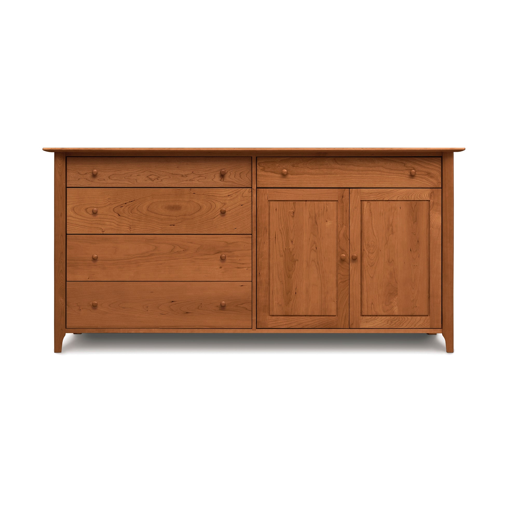 A luxury cherry wood sideboard from the Copeland Furniture Sarah Shaker Collection, with three drawers and two cabinet doors, isolated on a white background.