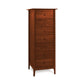 A tall wooden Sarah 7-Drawer Lingerie Chest, crafted from natural cherry wood with a reddish-brown finish, featuring seven drawers with round knobs and standing on four legs.
