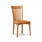 A solid American cherry wood Sarah Shaker Cherry Chair with Wooden Seat, with vertical slats in the backrest, standing isolated against a white background. (Copeland Furniture)