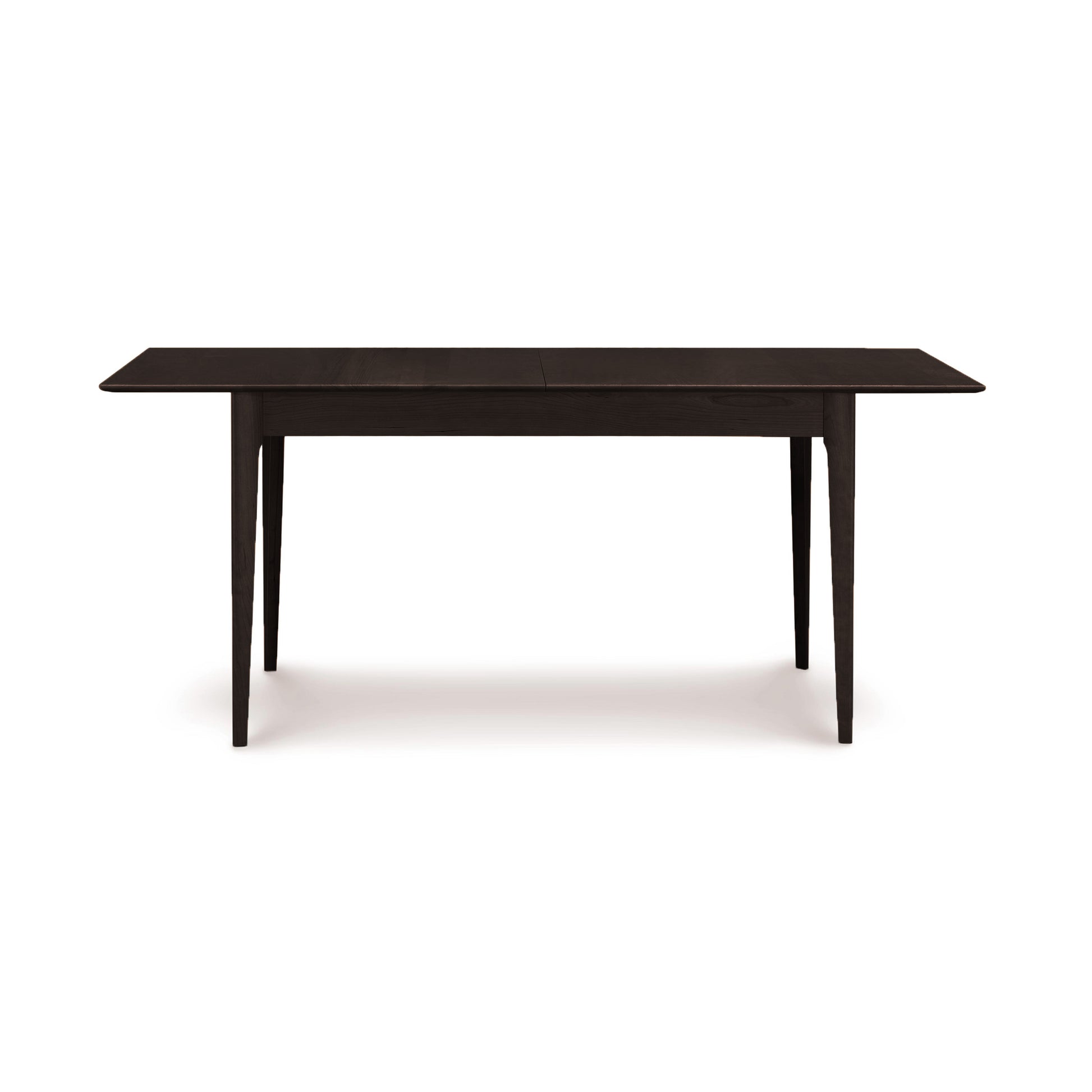 A rectangular dark cherry wooden table with a simplistic design, isolated on a white background from the Copeland Furniture Sarah Shaker Tapered Leg Extension Table.