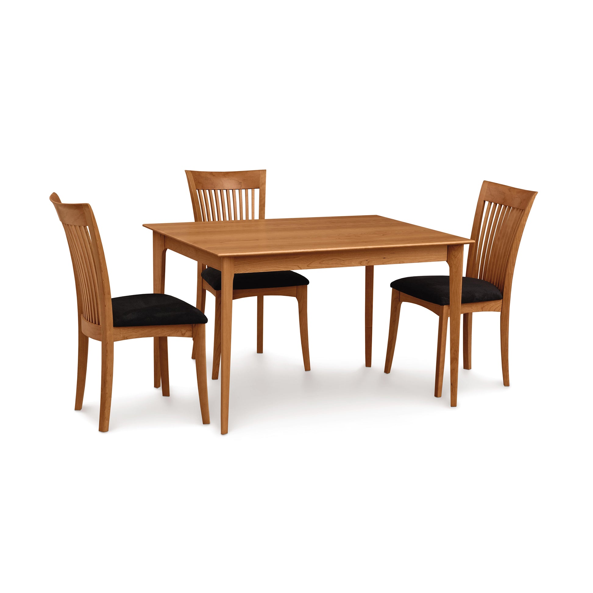 A Copeland Furniture Sarah Shaker Tapered Leg Solid Top Table with four matching chairs on a white background.