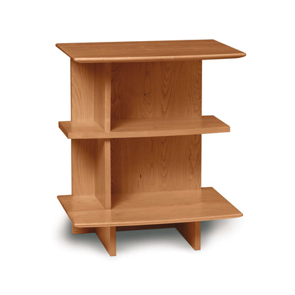 A simple wooden corner shelf unit from the Copeland Furniture Sarah Open Shelf Nightstand Collection isolated on a white background.