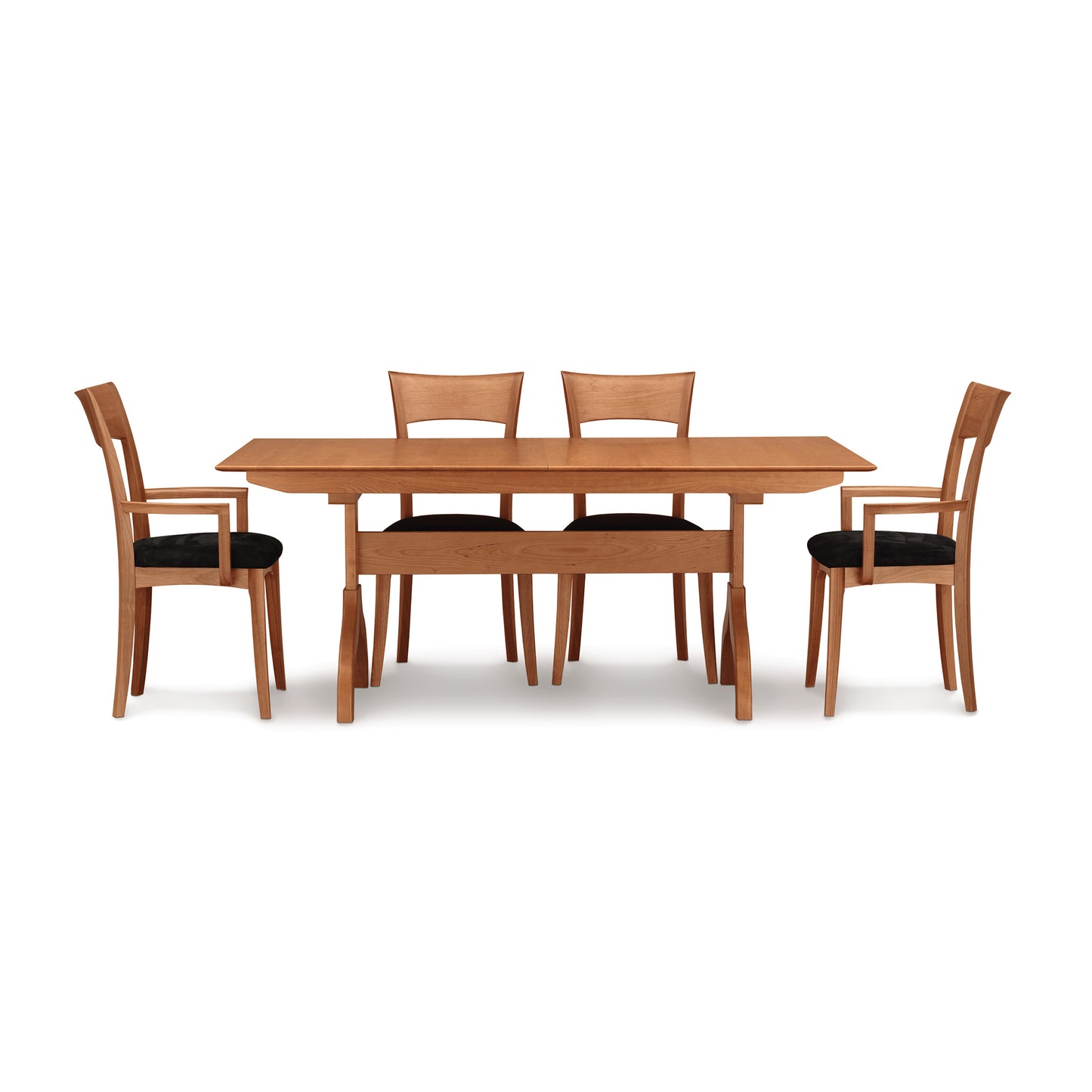 Copeland Sarah Shaker Trestle Extension Table with four Shaker collection chairs featuring black cushions, showcasing finely crafted wood furniture.