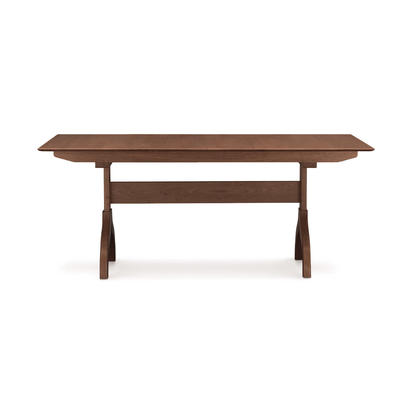 A Sarah Shaker Trestle Extension Table with drop-leaf sides on a white background by Copeland Furniture.