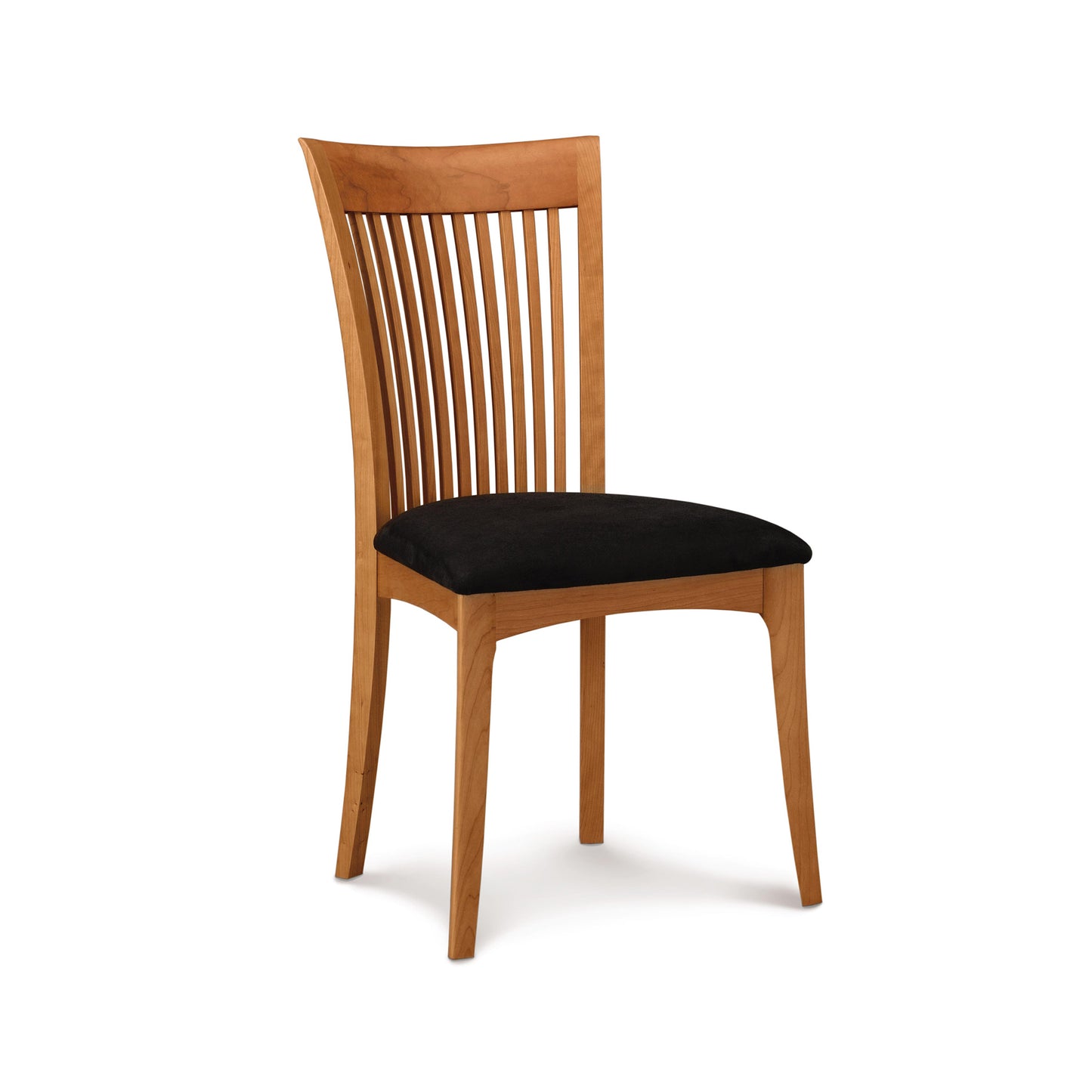 Sarah Shaker Chair by Copeland Furniture in cherry wood, featuring a curved slat back and black cushioned seat, American made.