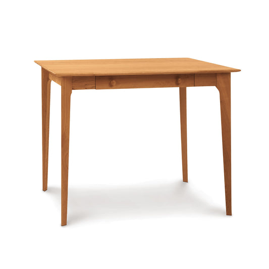 A Sarah Secretary Desk by Copeland Furniture with four legs and a single drawer, positioned against a white background.