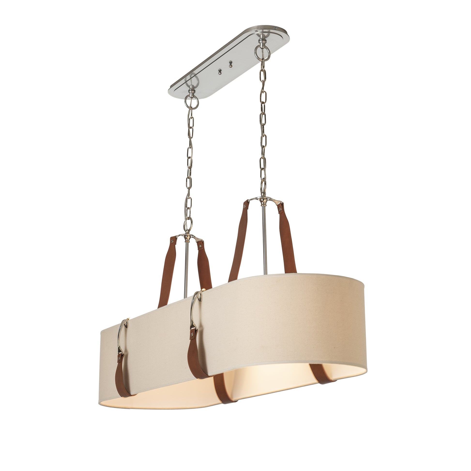A modern chandelier with a sleek, cream-colored shade and elegant brown leather equestrian straps, hanging from a polished silver base and chain in a simple, stylized room setting. The Saratoga Oval Pendant by Hubbardton Forge.