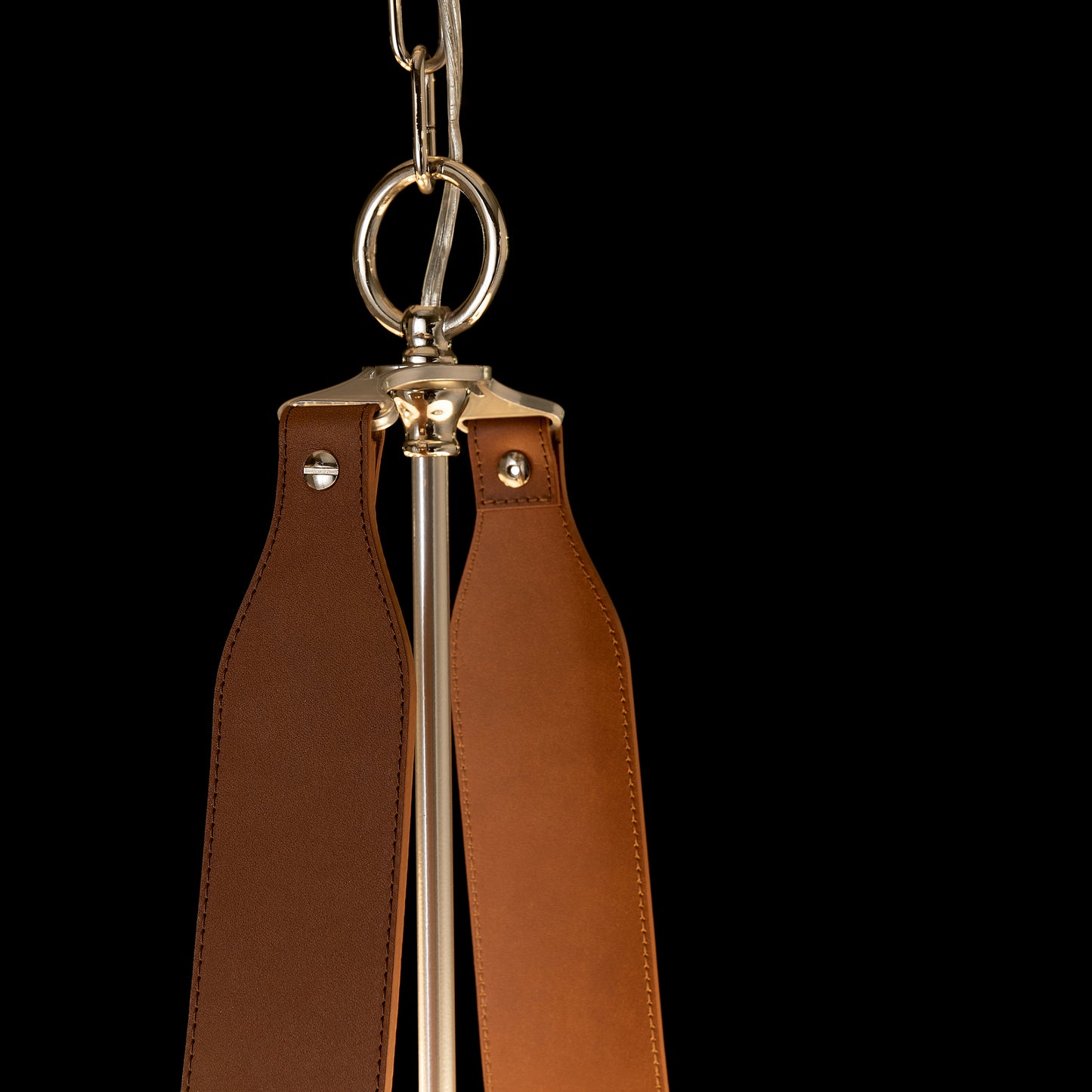 Saratoga Oval Pendant by Hubbardton Forge with leather swing and metal hardware.