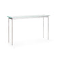 A Hubbardton Forge Senza console table with a tempered glass top and metal legs.