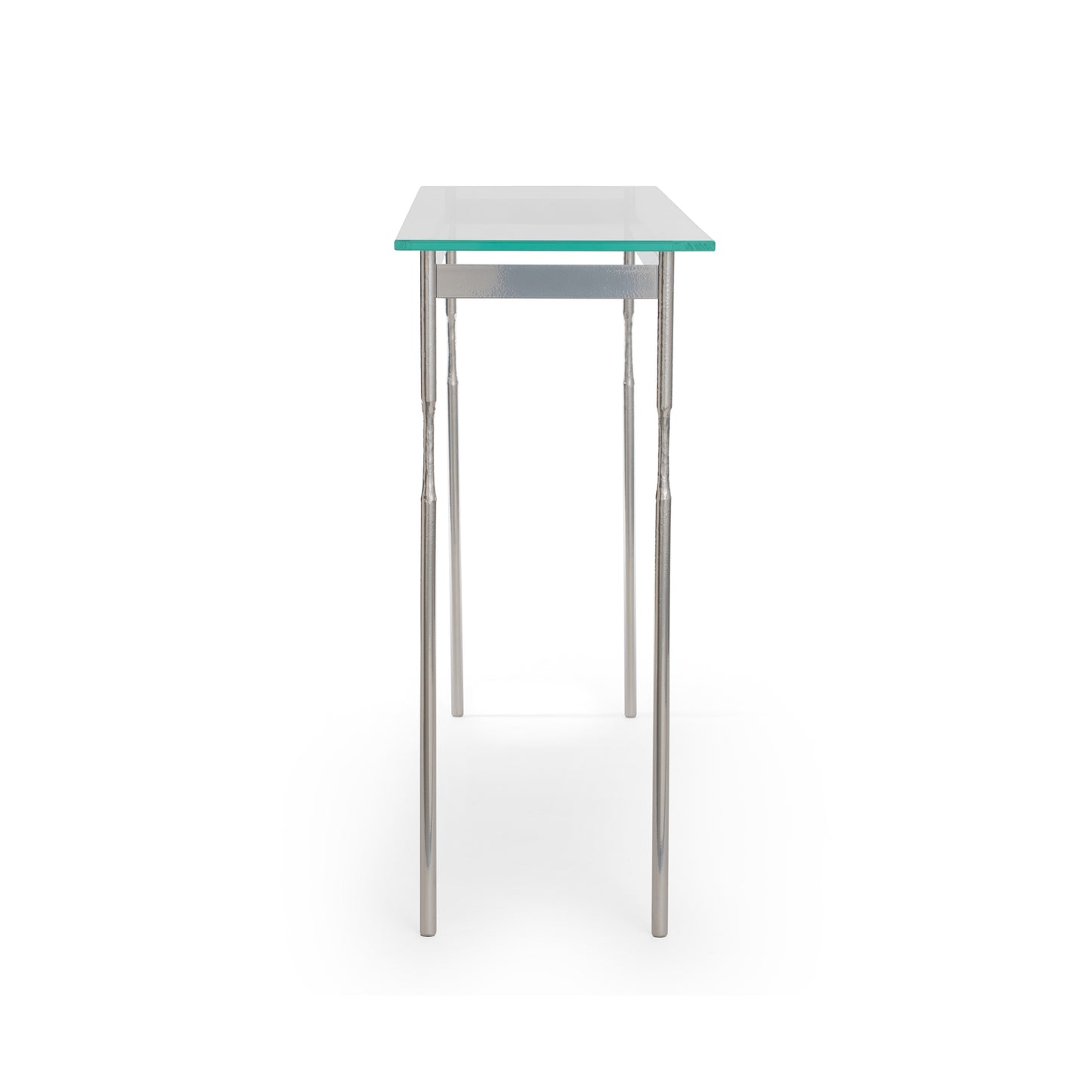 Hubbardton Forge Senza Console Table with a modern design, featuring a tempered glass top and elegantly handcrafted steel legs.