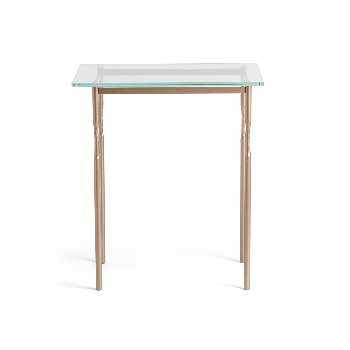 Senza Side Table by Hubbardton Forge featuring a sleek glass top and four elegantly handcrafted steel legs.