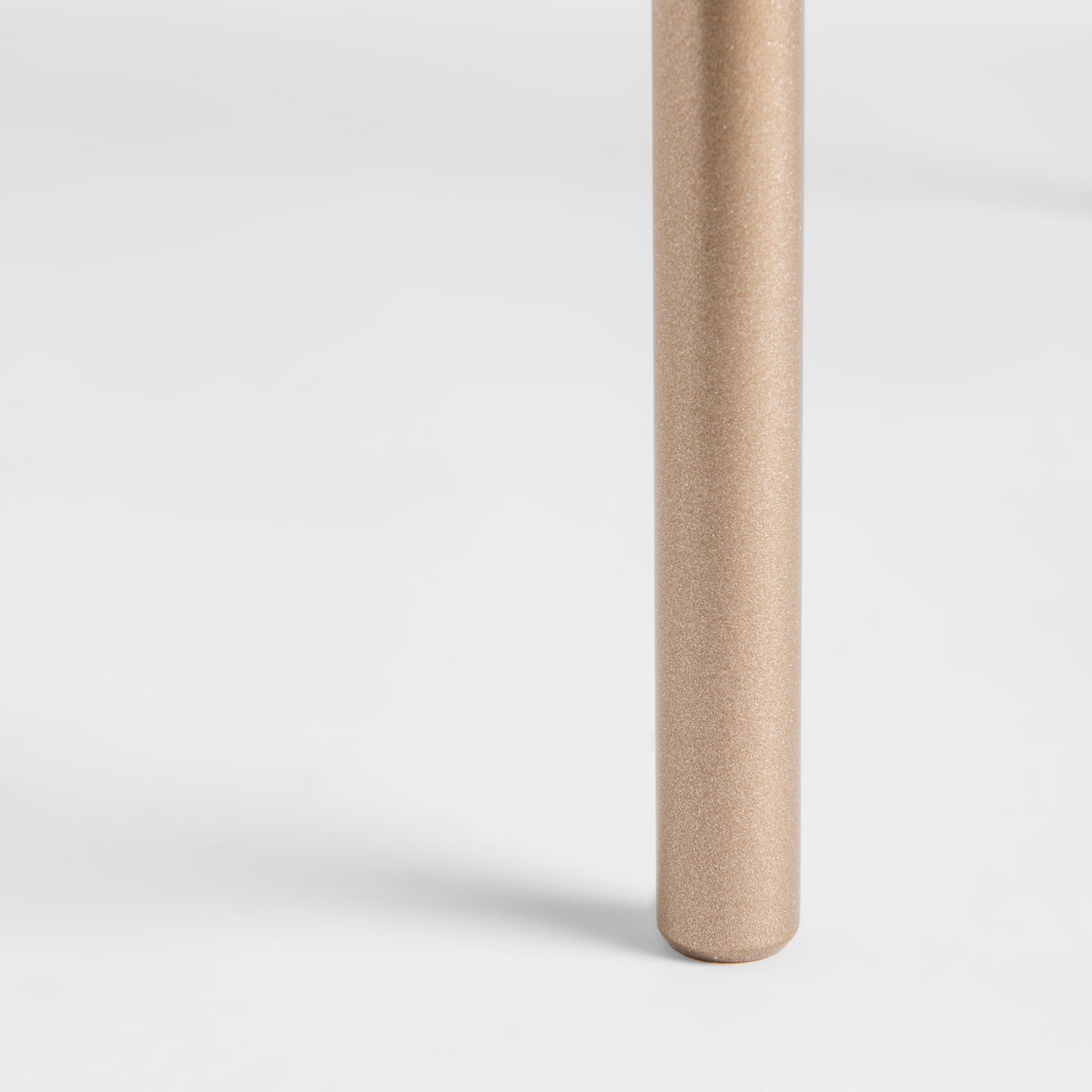 Hubbardton Forge Senza Side Table with handcrafted steel cylindrical leg, gold finish; perfect modern home accent.
