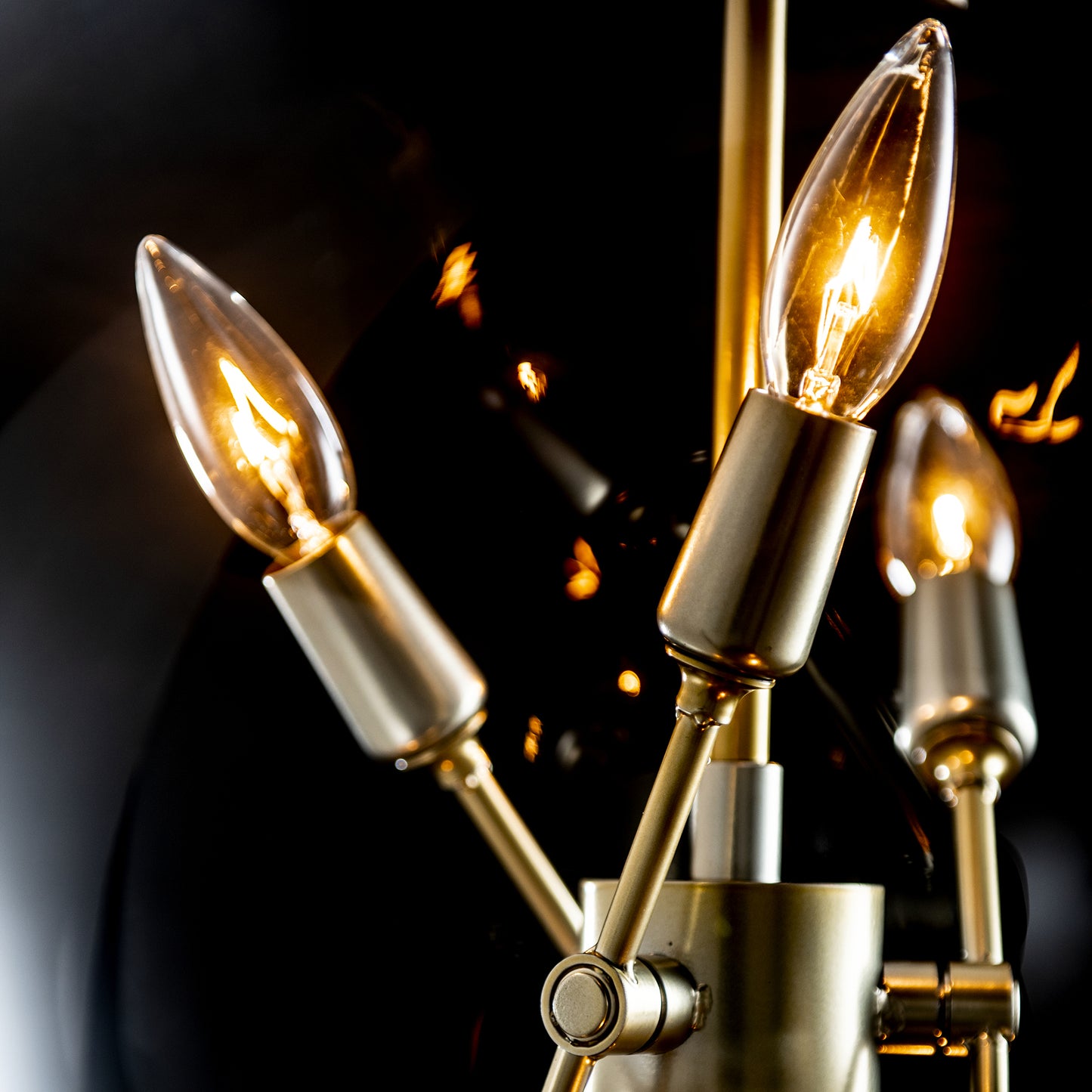 Hubbardton Forge Sfera 6-Light Pendant featuring gold metal fixtures with bulb-shaped lamps and clear glass orbs.