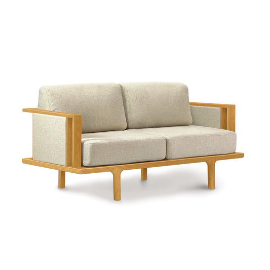 Copeland Furniture Sierra Upholstered Loveseat with modern design, straight armrests, and fabric panels, showcasing American-made craftsmanship.