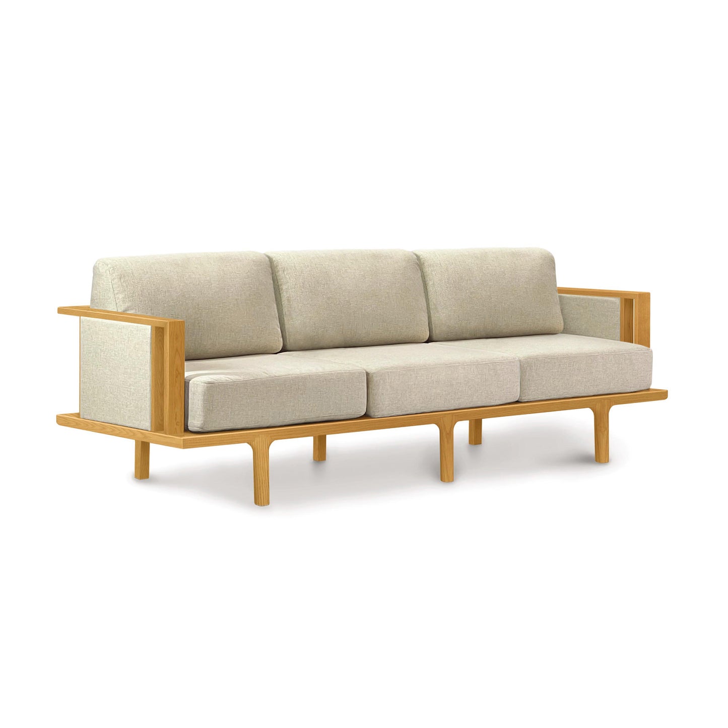 Light gray cushioned Sierra Sofa by Copeland Furniture with a wooden frame, accommodating three seats and featuring open armrests.