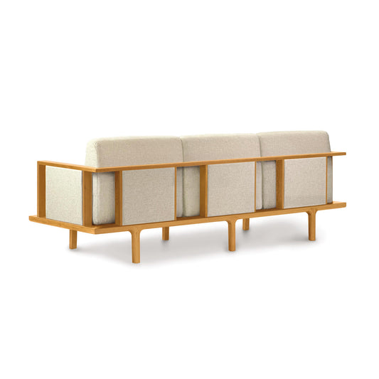Beige Copeland Furniture Sierra Upholstered Sofa with elegant wood frame and legs, showcasing contemporary design.