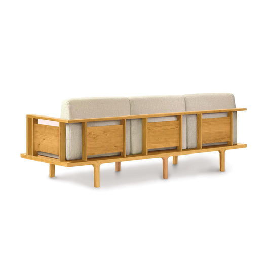 Sierra Upholstered Sofa by Copeland Furniture with minimalist rear view, beige cushions, and open square frame.