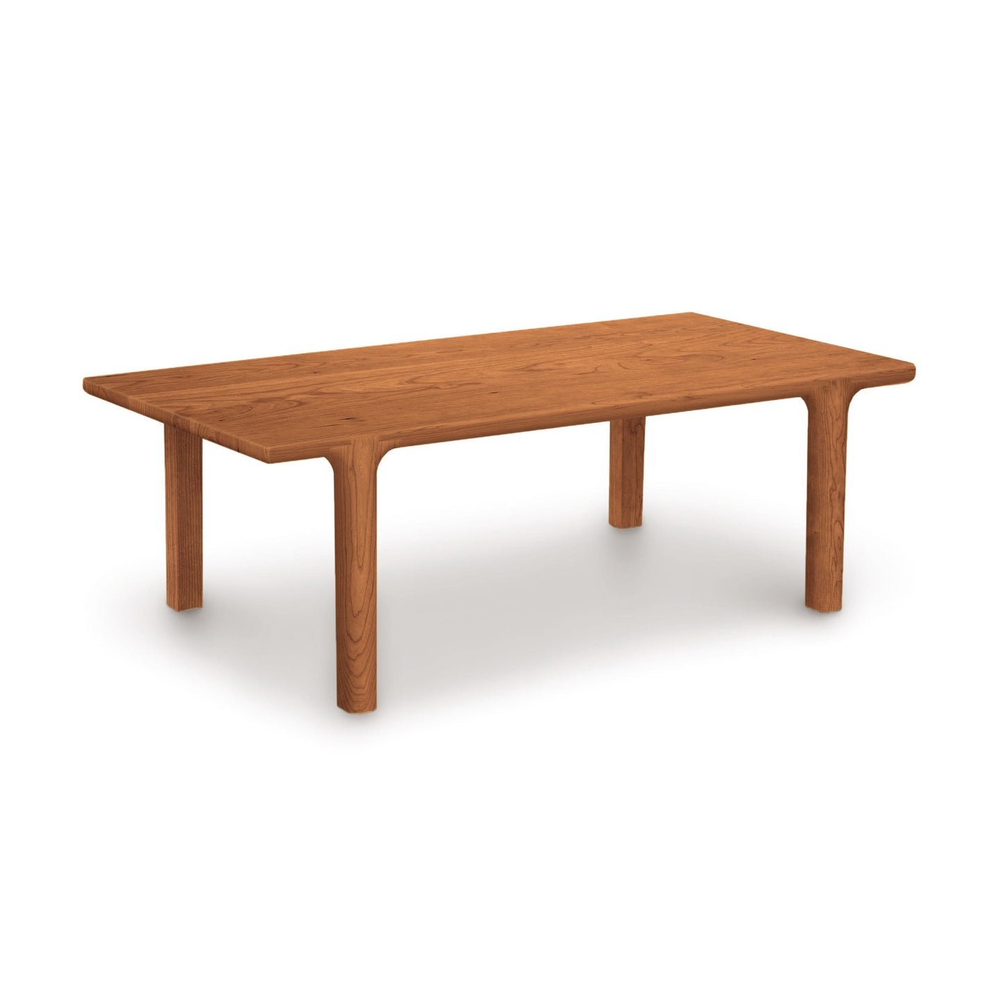 Sierra Rectangular Coffee Table by Copeland Furniture with rounded corners and thick legs, showcasing sleek, modern craftsmanship.