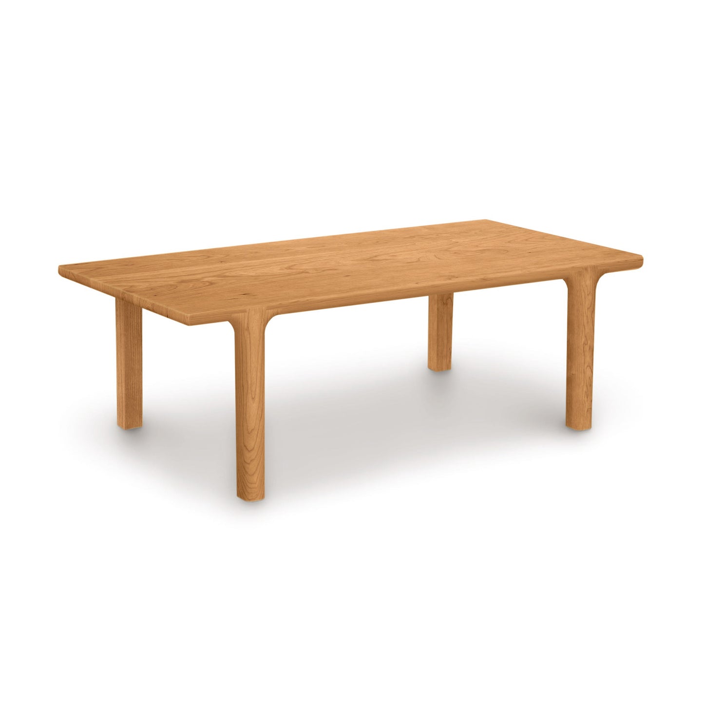 Sierra Rectangular Coffee Table by Copeland Furniture with rounded legs and edges, crafted in natural wood, focus on table design.