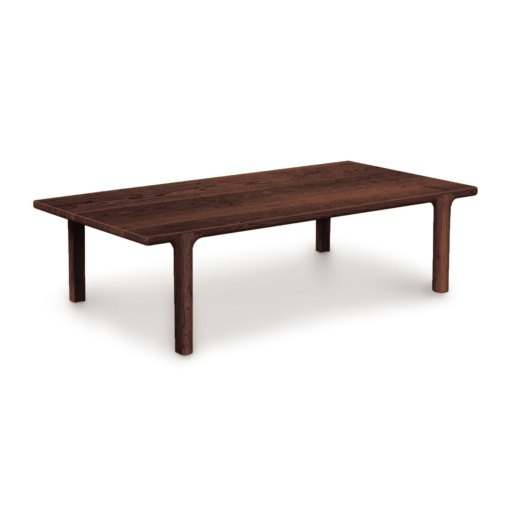 Sierra Rectangular Coffee Table by Copeland Furniture featuring customizable wood finishes and durable legs, shown against a plain backdrop.