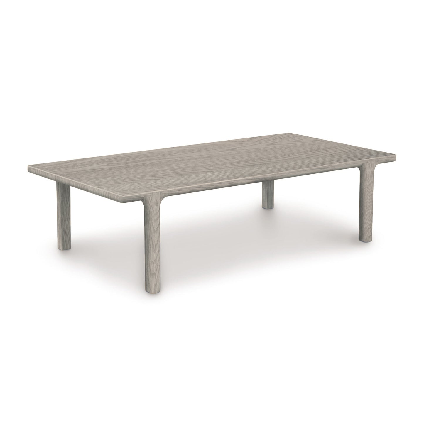 Sierra Rectangular Coffee Table by Copeland Furniture with rounded edges and four cylindrical legs, highlighting its modern wood design.