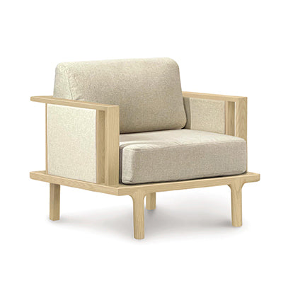 A Sierra Oak Upholstered Chair with Upholstered Panels by Copeland Furniture with custom upholstery options, featuring a wooden frame and beige fabric.