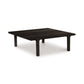 A low-profile, contemporary design Copeland Furniture Sierra Square Coffee Table made of North American hardwood, with a square top and four legs on a white background.