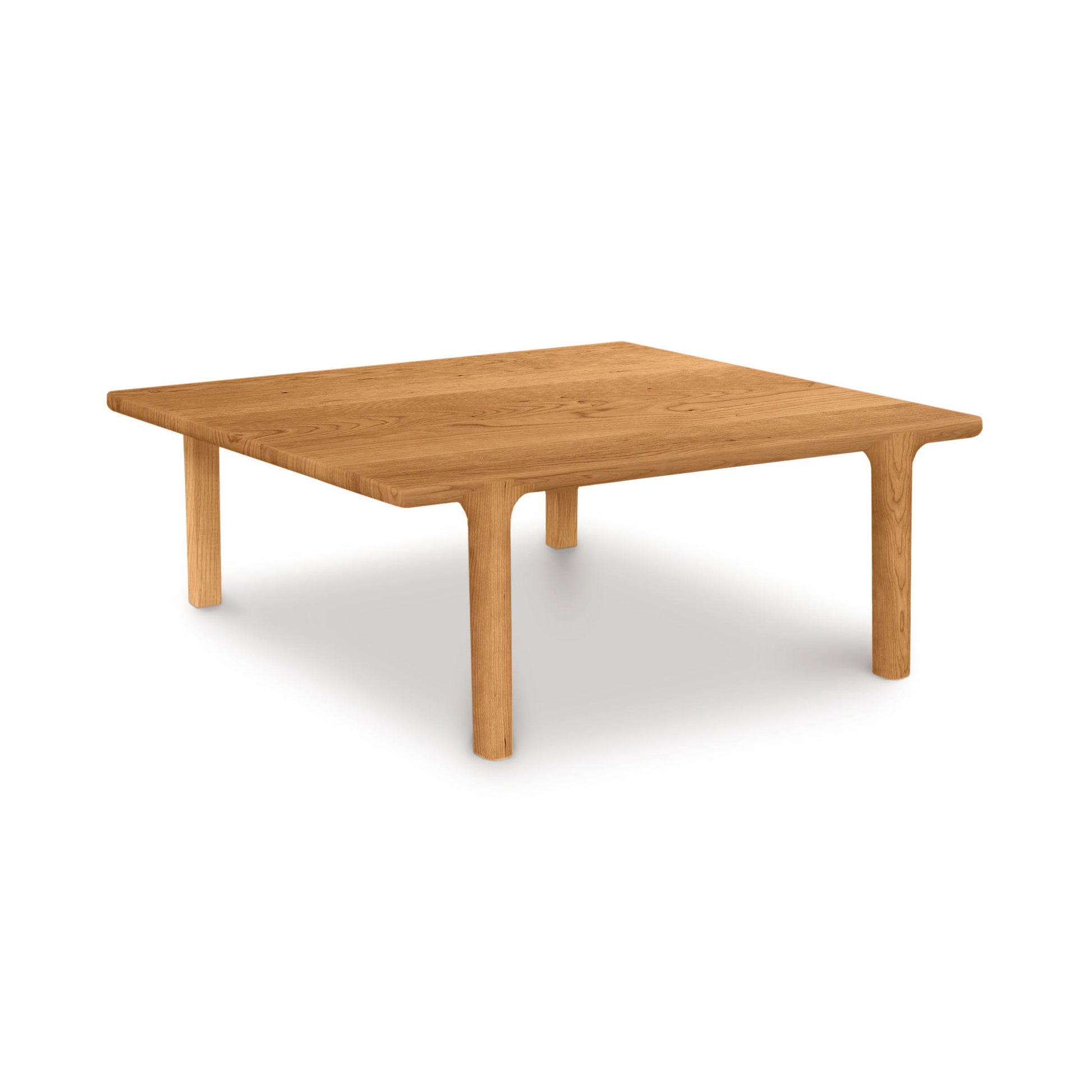 A simple Copeland Furniture Sierra Square Coffee Table with four legs and a rectangular top, isolated on a white background.